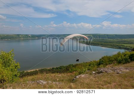 Paraglider Above Bakota Beautiful Reservoir In The Clouds