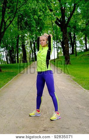 Woman doing stretching exercise before running 
