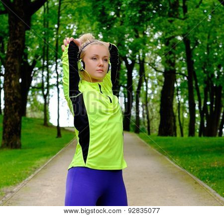Woman doing stretching exercise before running 