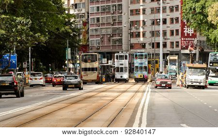 HONG KONG - JUNE 03, 2015: double-decker tram on street of HK. Hong Kong Tramways is a tram system in Hong Kong, being one of the earliest forms of public transport in the metropolis.