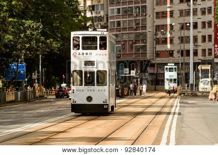 HONG KONG - JUNE 03, 2015: double-decker tram on street of HK. Hong Kong Tramways is a tram system in Hong Kong, being one of the earliest forms of public transport in the metropolis.