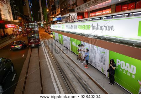 HONG KONG - JUNE 03, 2015: double-decker tram on street of HK. Hong Kong Tramways is a tram system in Hong Kong, being one of the earliest forms of public transport in the metropolis.