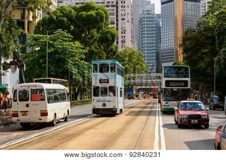 HONG KONG - JUNE 03, 2015: double-decker tram on street of HK. Hong Kong Tramways is a tram system in Hong Kong, being one of the earliest forms of public transport in the metropolis.