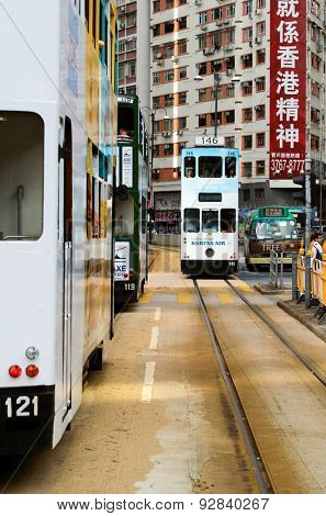 HONG KONG - JUNE 03, 2015: double-decker tram on street of HK. Hong Kong Tramways is a tram system in Hong Kong, being one of the earliest forms of public transport in the metropolis.