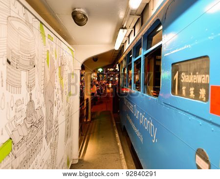 HONG KONG - JUNE 03, 2015: double-decker tram on street of HK. Hong Kong Tramways is a tram system in Hong Kong, being one of the earliest forms of public transport in the metropolis.