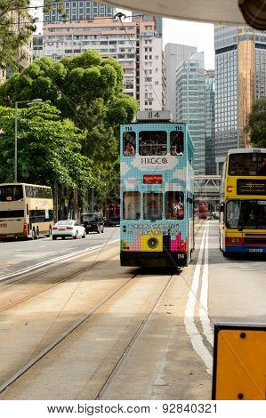 HONG KONG - JUNE 03, 2015: double-decker tram on street of HK. Hong Kong Tramways is a tram system in Hong Kong, being one of the earliest forms of public transport in the metropolis.