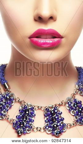 Close-up Portrait Of Young Woman With Bright Lipstick