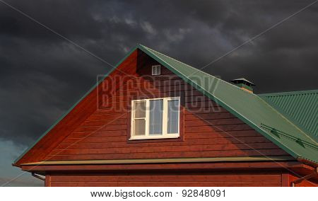 Green Metal Roof Under Dark Cloudy Sky