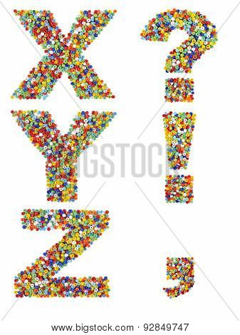 Letters Of The Alphabet X Through Z And Punctuation Marks Made From Colorful Glass Beads On A White