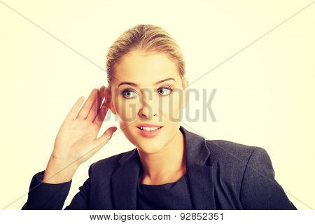 Beautiful woman overhearing a conversation