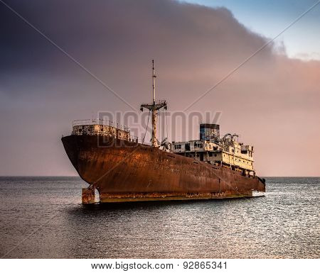 old broken ship agrounded near Lanzarote seashore, Canary Islands, Spain