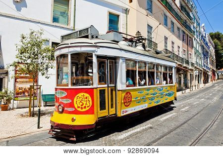 Traditional Vintage Lisbon Yellow Tram Decorated With Sardines