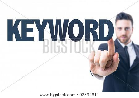Business man pointing the text: Keyword