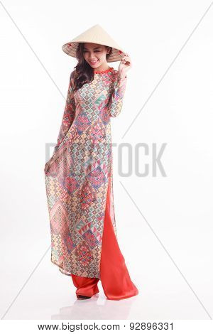 Beautiful Vietnamese Young Woman With Modern Style Ao Dai And Palm-leaf Conical Hat ( Non La ) On Wh