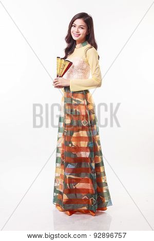 Beautiful Vietnamese Young Woman With Modern Style Ao Dai Holding A Paper Fan On White Background