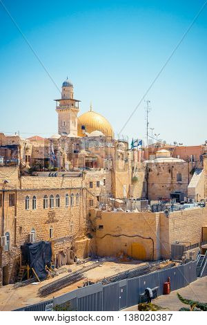 View of the Wailing Wall and on the gold-plated Dome Rock Al-Aqsa, Temple Mount, minaret, Jerusalem. Israel.