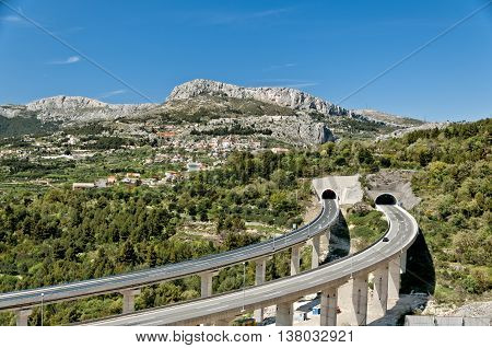 croatian motorway with curved viaducts and tunnel entrance near klis dalmatia croatia