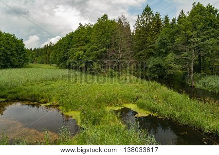 The picturesque Rospuda river old wooden bridge Poland