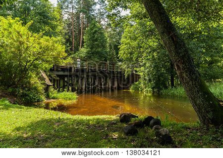The picturesque Rospuda river old wooden bridge Poland