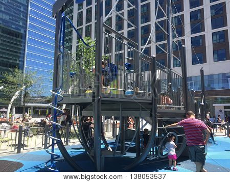 TYSONS CORNER, VIRGINIA - July 3, 2016. An outdoor playground for families on the 3rd floor of Tysons shopping center next to a popular fast food burger place called Shake Shack.