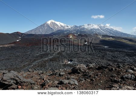 Volcanic landscape of Kamchatka Peninsula: beautiful view of Tolbachik Volcanic Massif - cone of dormant Ostry Tolbachik Volcano and cone of active Plosky Tolbachik Volcano on a clear sunny weather. Eurasia Russian Far East Kamchatsky Region Klyuchevskaya