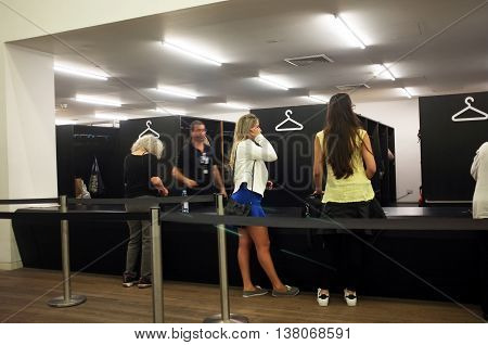 LONDON,UK - JULY 06, 2016: People wait to collect their belongings at the cloakroom of Tate Modern in London