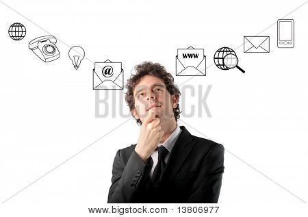Thoughtful businessman with icons on the background