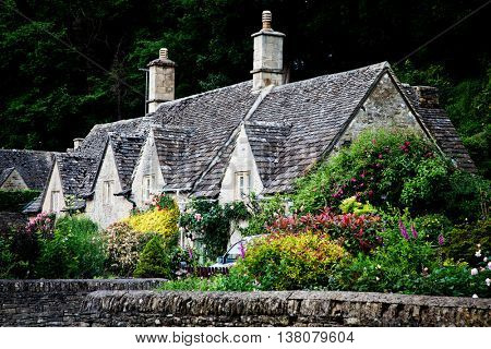 Traditional Cotswold cottages in England, UK. Bibury is a village and civil parish in Gloucestershire, England.