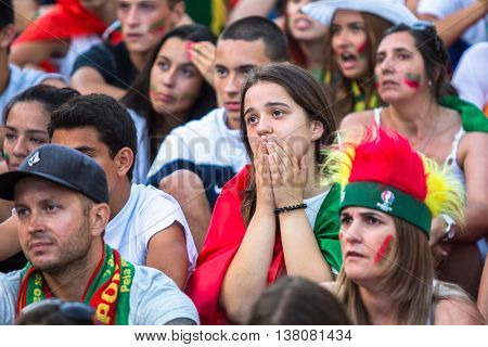PORTO, PORTUGAL - JUL 10, 2016: Portuguese fans during translation of the football match Portugal - France final of the European championship 2016, in Liberdade Square at city center of Porto. 