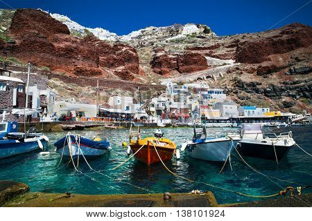 Ammoudi village with fishing boats on Santorini island, Greece.
