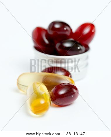 Picture of a Cod liver oil omega 3 gel and krill oil capsules isolated on white background