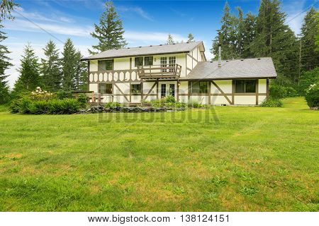 Farm House Backyard With Green Lawn