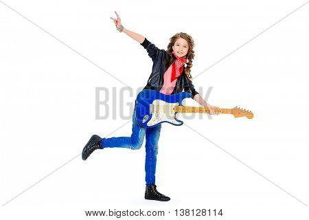 Cute teen girl playing on her electric guitar. Isolated over white. 