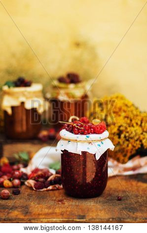 Homemade Strawberry Pits. Dessert Made Of Must And Flour Placed Inside Small Jars. Homemade Raspberr