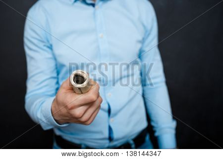 close up shop man holding dollars. suited. watch