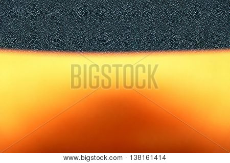 Top view background of orange chair. Focus on cushion, blurred backrest.