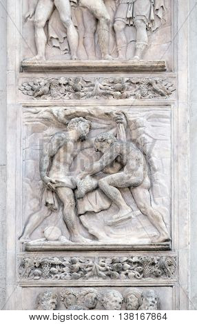BOLOGNA, ITALY - JUNE 04: The brothers tinged Joseph's coat with the blood by Giacomo Raibolini, right door of San Petronio Basilica in Bologna, Italy, on June 04, 2015