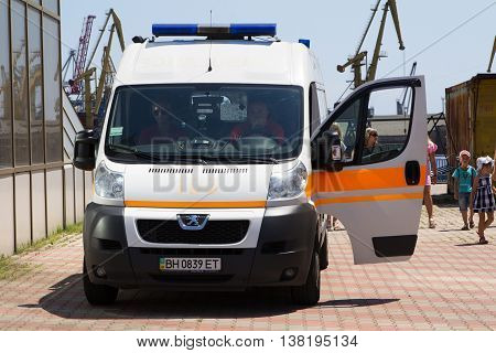 Odesa, Ukraine - July 03, 2016: Pumped police officer in red beret and with a large white inscription on the back 'Police'. Navy day celebration in Odesa