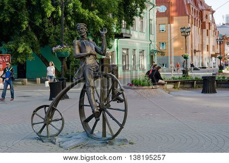 Yekaterinburg Russia - July 10 2016: The bronze sculpture of the inventor of the bike Artamonov set on the street Weiner in Yekaterinburg.