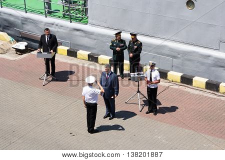 Odesa, Ukraine - July 03, 2016: President of Ukraine Petro Poroshenko awards sailors and soldiers on the pier of the Odessa port. Navy day celebration in Odesa