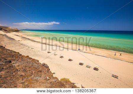 View to sandy beach with vulcanic mountains in the background near to the Costa Calma Fuerteventura Canary Islands Spain.