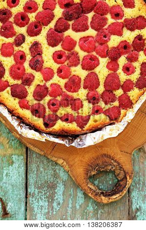 Homemade pie with organic raspberries topview vertical