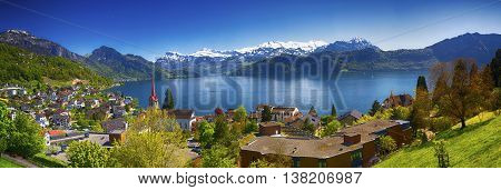 Panorama image of village Weggis lake Lucerne (Vierwaldstatersee) Pilatus mountain and Swiss Alps in the background near famous Lucerne (Luzern) city Switzerland