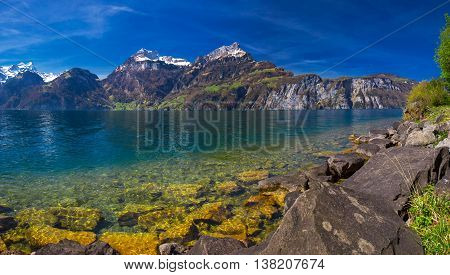 View to Swiss Alps and Lucerne lake from Sisikon village Switzerland