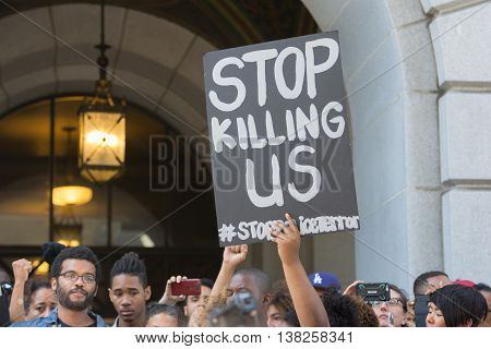 Black Lives Matter Protestors Holding A Poster During March On City Hall