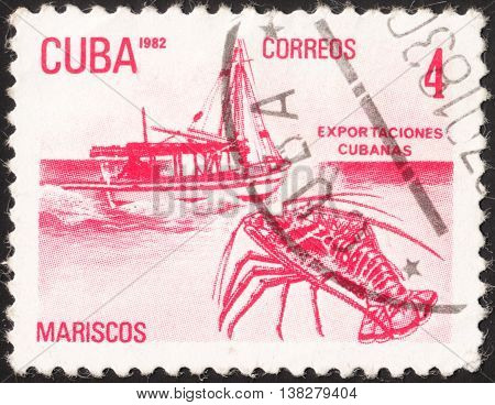 MOSCOW RUSSIA - JANUARY 2016: a post stamp printed in CUBA shows a boat and a lobster (Mariscos) the series 