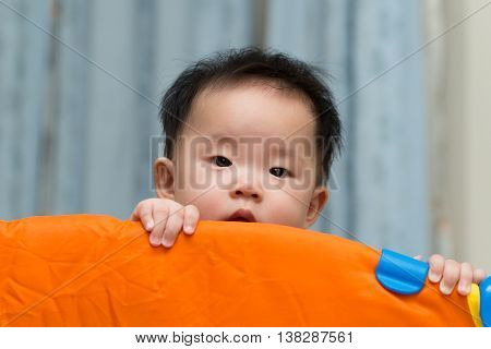 Asian Baby In Playpen