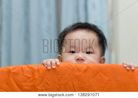 Asian Baby In Playpen