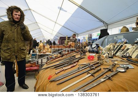 KAUNAS, LITHUANIA - MAR 23: Unidentified people in a traditional flea market in second biggest Lithuanian city - Kaunas, on March 23, 2013 in Kaunas, Lithuania