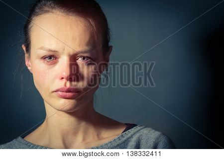 Young woman suffering from severe depression/anxiety/sadness